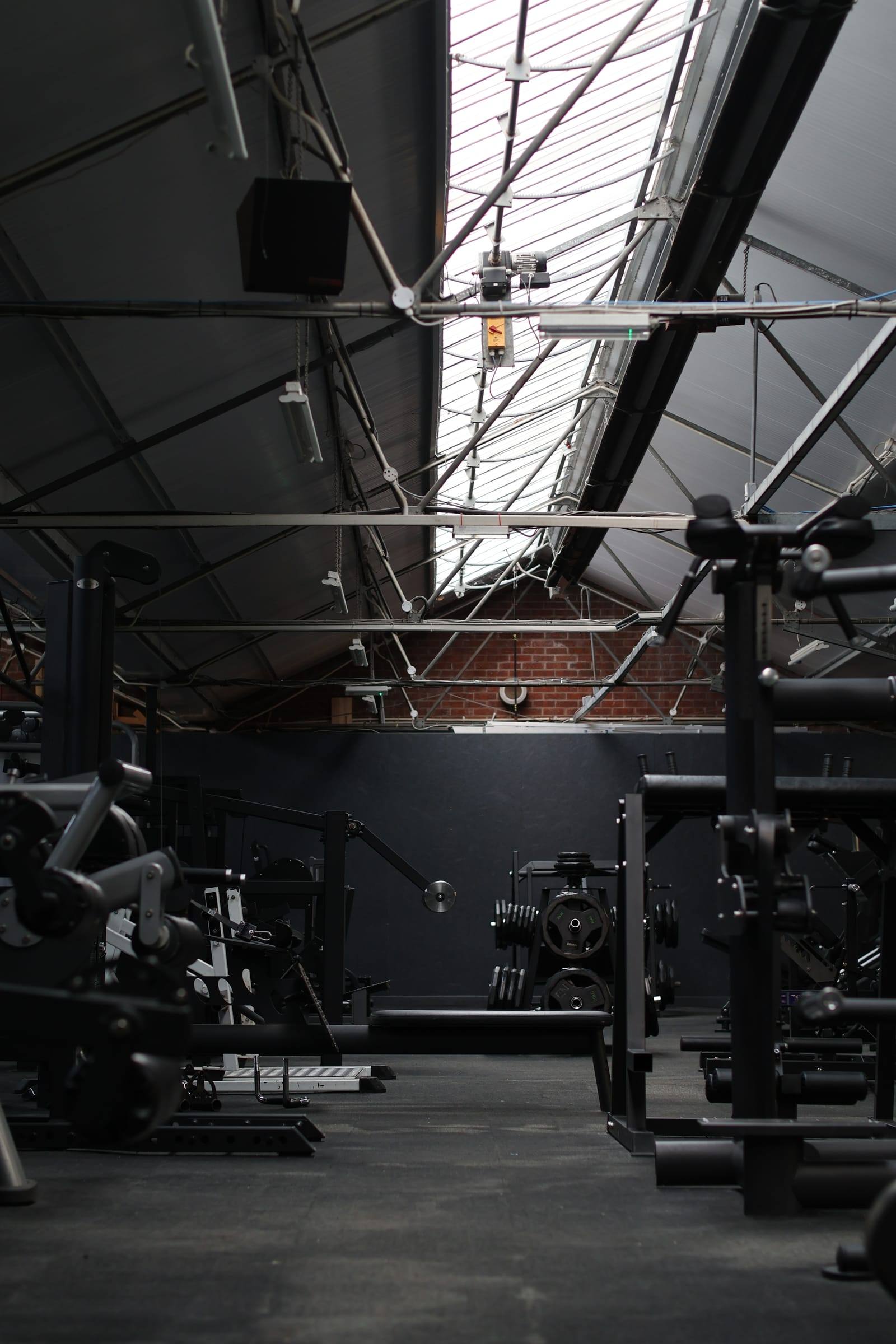 Corner of the Bristol gym with cable and plate-loaded machines