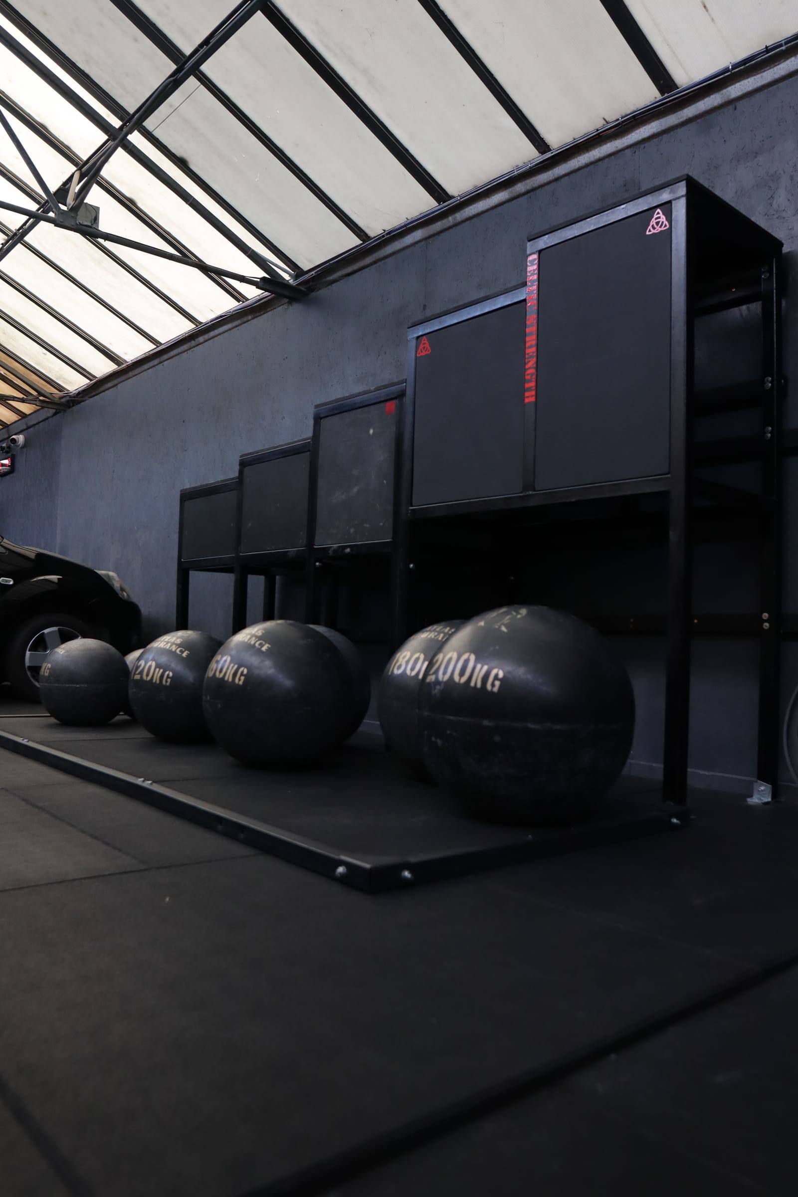 Heavy rubber stone balls lined up against the wall in the Bristol functional area